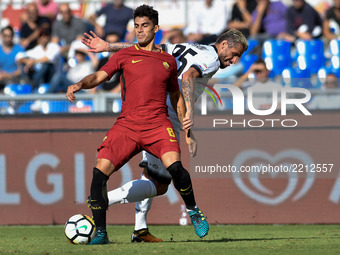 Diego Perotti of Roma is challenged by Valon Behrami of Udinese during the Serie A match between Roma and Udinese at Olympic Stadium, Roma,...
