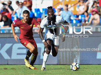 Seko Fofana of Udinese is challenged by Kevin Strootman of Roma during the Serie A match between Roma and Udinese at Olympic Stadium, Roma,...