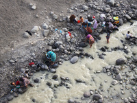 Peoples bathed, washed clothes and took waters for daily use in the Cipamingkis river that began to dry at Cibarusa district, West Java on S...