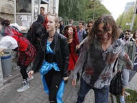 Ukrainians dressed up as zombies take part in a 