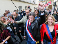 La France Insoumise (LFI) leftist party parliamentary group President Jean-Luc Melenchon (C)  joins a protest organized in Paris on Septembe...