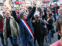 La France Insoumise (LFI) leftist party parliamentary group President Jean-Luc Melenchon (C)  gestures during a protest organized in Paris o...