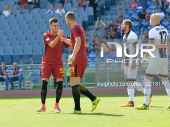 Edin Dzeko celebrates with Stephan El Shaarawy  after scoring a goal during the Italian Serie A football match between A.S. Roma and Udinese...