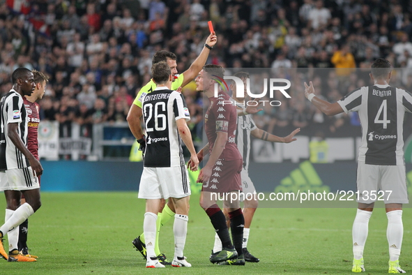 The referee expels Baselli of Torino during the Serie A football match between Juventus FC and Torino FC at Allianz Stadium on 23 September,...