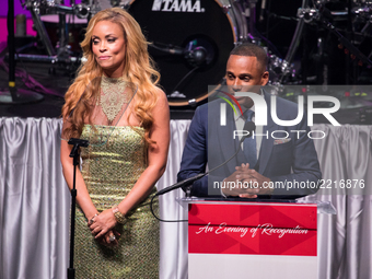 (L-R), TV personality Gizelle Bryant, and actor Hill Harper, speak at the Southern Company hosted 