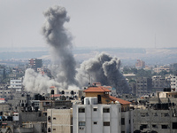 Smoke rises after Israeli air strikes over Gaza City, on 23 August 2014. (