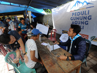 The medical team conducts health checks on refugees at IDP camps in Sidemen, Karangasem, Bali, October, 4.2017. Doctors and Volunteers from...
