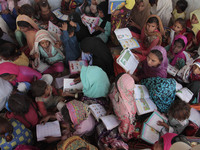 Pakistani bricks kiln students read books  on the eve of World Teachers Day in Lahore,October 05,2017.World Teachers' Day, held annually on...