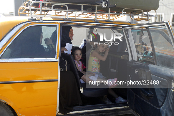 RAFAH, GAZA STRIP, PALESTINE - AUGUST 25: Palestinian travelers wait before crossing into Egypt at the Rafah border crossing with Egypt in t...