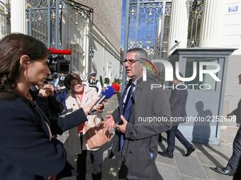 Secretary General of police's union UNSA Police Philippe Capon (C) arrive to meet with the Minister of Interior Gérard Collomb on October 09...