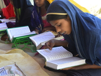 Rohingya Children are learning the Qur'an in a Madrasa at the Balukhali makeshift camp in Cox's Bazar, Bangladesh on October 10, 2017. Sever...