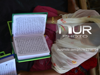 Rohingya Children are learning the Qur'an in a Madrasa at the Balukhali makeshift camp in Cox's Bazar, Bangladesh on October 10, 2017. Sever...