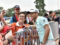 Xander Schauffele of USA takes picture with supporters during the second round of the CIMB Classic 2017 golf tournament on October 13, 2017...