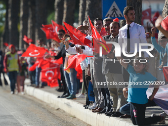 Members of the public and supporters with Turkish flags during the fourth stage - the 204.1 km Turkish Airlines Marmaris to Selcuk stage of...