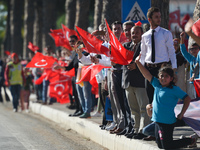 Members of the public and supporters with Turkish flags during the fourth stage - the 204.1 km Turkish Airlines Marmaris to Selcuk stage of...