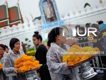 On the first anniversary of Thailand's King Bhumibol Adulyadej's death thousands of Thai mourners queue up outside the gates of the royal pa...