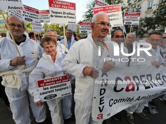 Protestors from the National Association for the Defense of Victims of Asbestos (ANDEVA) and from others associations demonstrate to pass ju...