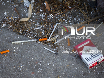 The picture show used syringes line a sidewalk in Los Angeles, CA, USA on 12 October 2017. (