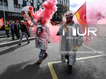 Metalworkers demonstrate as they march with banners and flags in the streets of Paris on October 13, 2017. Several thousand workers have tak...