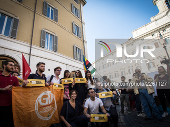 People stage a protest in support of the IUS SOLI law pro citizenship for children of migrants, outside the Italian Parliament on 13 October...