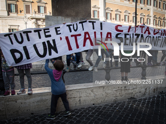 People stage a protest in support of the IUS SOLI law pro citizenship for children of migrants, outside the Italian Parliament on 13 October...