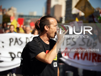 A man shouts slogans in front of a banner against Macron's social polices.As Macron's government reduce personnal housing allowance of 5€ (p...