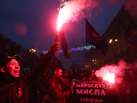 Activists and supporters of Ukrainian far right nationalist parties burn flares, torches and smoke grenades during their march to mark the 7...
