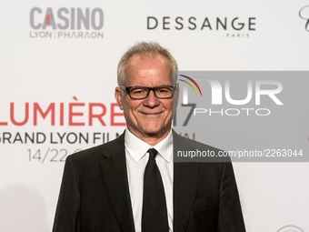Thierry Frémaux, the director of the Lumière Institute, poses in front of the photographers when he arrives at 9th Film Festival Lumiere In...