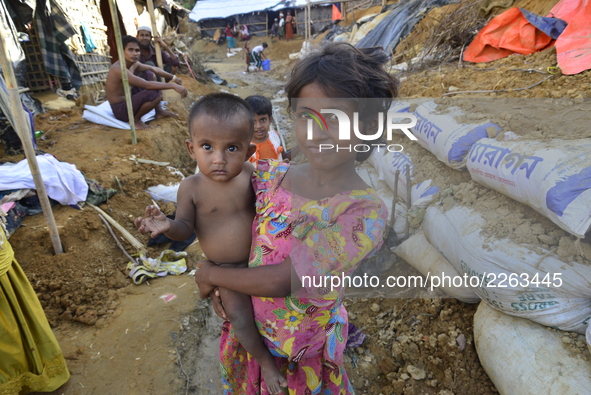 Rohingya child pose at the Balukhali makeshift Camp in Cox's Bazar, Bangladesh, on October 7, 2017. According to the United Nations High Com...