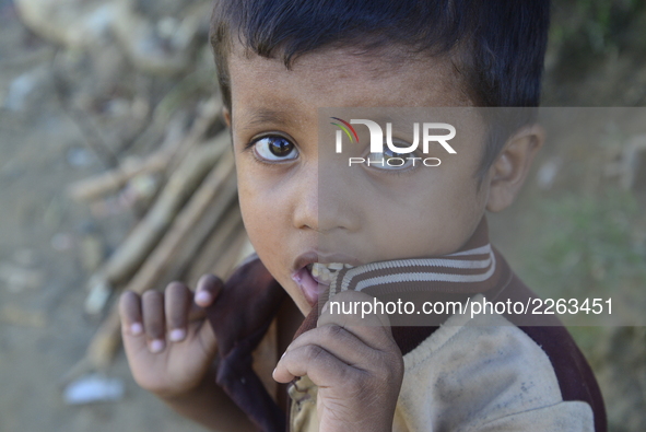 A Rohingya child pose at the Balukhali makeshift Camp in Cox's Bazar, Bangladesh, on October 7, 2017. According to the United Nations High C...