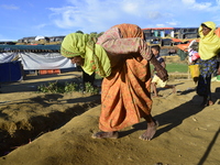 Rohingya refugee walks at the Balukhali makeshift Camp in Cox's Bazar, Bangladesh, on October 7, 2017. According to the United Nations High...