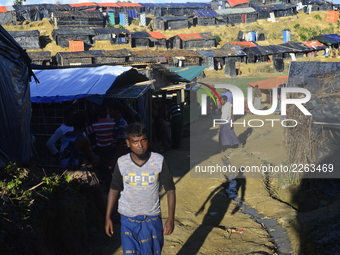 Rohingya refugee walks at the Balukhali makeshift Camp in Cox's Bazar, Bangladesh, on October 7, 2017. According to the United Nations High...