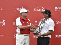 Pat Perez(R) of USA pictured with Malaysia's Prime Minister Najib Razak(L) after he won the CIMB Classic 2017 on October 15, 2017 at TPC Kua...