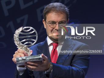 Spanish writer Javier Sierra smiles as he poses after receiving the Spain's 2017 'Premio Planeta' award for his book 'El Fuego Invisible' (T...