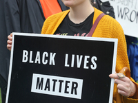Protestor holds a sign saying 'Black Lives Matter' during a rally against White Supremacy and Islamophobia at Queen's Park in Toronto, Ontar...