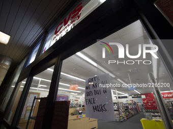 A CVS Pharmacy in Mountain View, California displays a sign on October 15, 2017, showing customers that the store no longer has face mask. T...