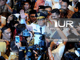  The new Governor of DKI Jakarta Anies Baswedan (middle) with supporters  happy to be inaugurated and headed to Jakarta City Hall office, In...