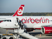 Passengers board on a machine of the bankrupted airline Airberlin at Tegel airport in Berlin, Germany on October 16, 2017. (