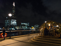 The igloos are seen on the Thames-side terrace of the Coppa Club restaurant, against the backdrop of The Shard, in London on October 16, 201...