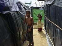 Rohingya children pose at the Unchiprang makeshift Camp in Cox's Bazar, Bangladesh, on September 07, 2017. According to the United Nations H...