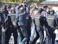 Turkish riot policemen disperse woman protesters, who were going to march to the Grand National Assembly of Turkey (TBMM) to protest against...