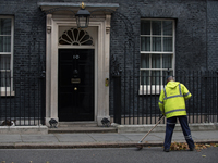 A street cleaner is seen at work outside 10 Downing Street, London on October 17, 2017. (