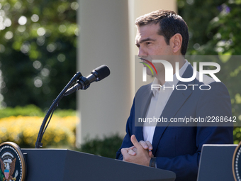 Prime Minister Alexis Tsipras of Greece listens, during his joint press conference with U.S. President Donald Trump, in the Rose Garden of t...