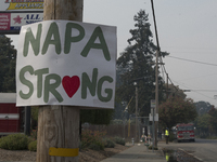 A sign created by resident of Napa, California is seen near a parking lot in downtown Napa where Cal Fire crew and other fire-fighting force...