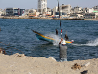 Palestinian fishermen set off for the sea in Gaza City on October 18, 2017 on the first day that fishermen will be allowed by Israel to trav...
