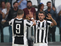 Juventus defender Andrea Barzagli (15) celebrates with Juventus forward Gonzalo Higuain (9) during the Serie A football match n.8 JUVENTUS -...