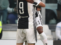 Juventus forward Douglas Costa (11) celebrates with Juventus forward Gonzalo Higuain (9) after scoring his goal during the Serie A football...