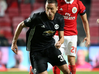 Manchester United's Serbian midfielder Nemanja Matic vies with Benfica's Portuguese midfielder Pizzi (R ) during the UEFA Champions League f...