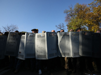 Protesters guard holds atheir shields together as they prepare for possible police attack on a camp in front of Ukrainian Parliament in Kyiv...