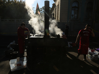 Protesters cooks prepare a first dishes for an inhabitants of a camp in front of Ukrainian Parliament in Kyiv, Ukraine, Oct.18, 2017. Dozens...